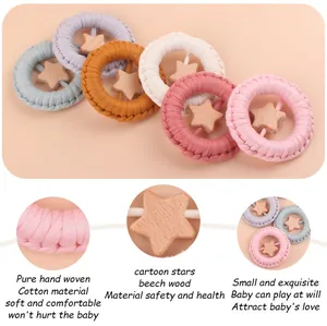 Detail of hand-woven cotton rings and beech wood stars in vibrant multi-color set