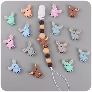 Detailed view of DIY silicone baby pacifier clips and cute cartoon reindeer teething beads