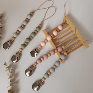Silicone and wooden bead pacifier clips in assorted Morandi colors for infant teething