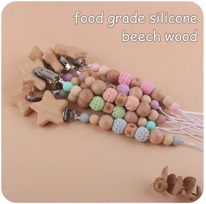 Detail of beech wood star clips and macaron silicone beads for baby pacifier chains