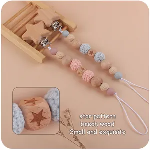 Star-patterned beech wood pacifier clip with handmade crochet beads and metal clamp