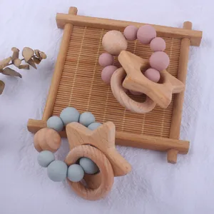 Baby star teether set made of natural beech wood and soft silicone beads in rose and blue