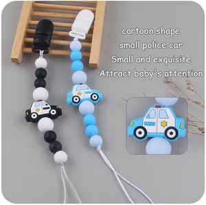 Close-up of silicone police car beads on a pacifier clip for soothing teething babies