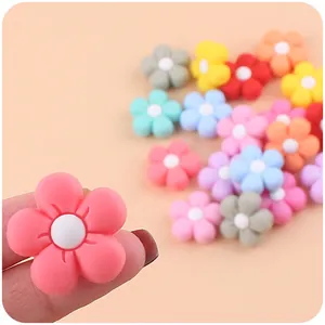 Close-up of colorful silicone flower accessories for DIY baby pacifier clips
