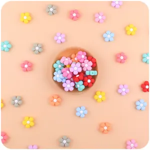 Macro view of colorful silicone flower beads for baby pacifier clips and DIY crafts