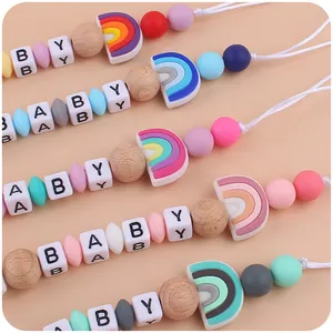 Siliconen regenboog speenkoord met houten kralen voor baby's tandjes en kalmerend effect