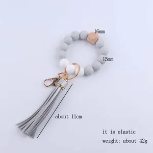 Silikon-Armband-Schlüsselanhänger mit grauen Quasten und sechseckiger Holzperle