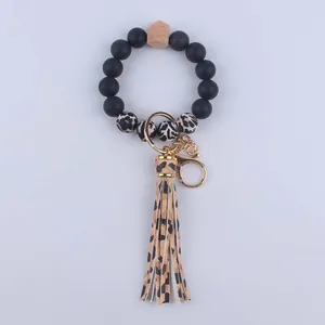 Silicone beaded wristlet keychain with leopard print beads, wood bead and leather tassel