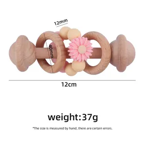 Daisy silicone beads and beech wood baby rattle with product dimensions 12cm long