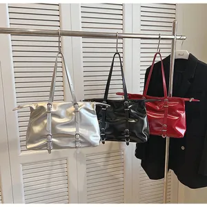 Modern glossy tote bags in silver, black, and red with decorative metallic buckle straps