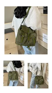 Detail shot of army green nylon backpack with vintage metal buckles and utility pockets