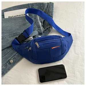 Blue canvas waist bag with adjustable strap and multiple zip pockets for sport use