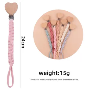 Handmade woven pacifier clips with beech wood hearts in various pastel colors