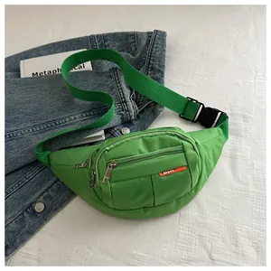 Detail view of a neon green sports waist bag featuring heavy-duty buckle and nylon strap