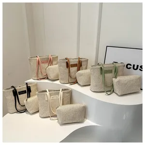Detailed close-up of straw tote bags set in five colors with matching coin purses