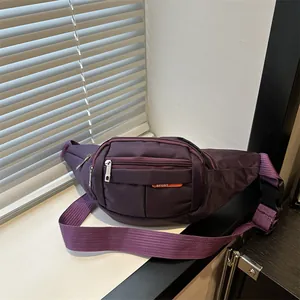 Durable purple canvas sports fanny pack with multi-layer zippers and buckle strap
