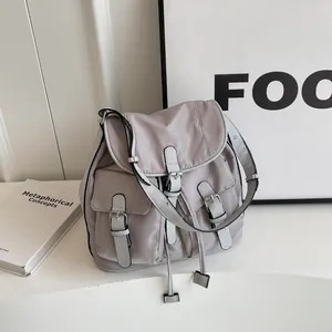 Minimalist light grey canvas shoulder bag with multi-pocket vintage utility design