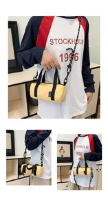 Detailed view of yellow cylinder mini crossbody bag with rope strap and top handles