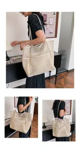 Detail view of large cream mesh beach tote with multiple functional pockets and durable straps