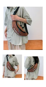 Detailed view of brown sports chest bag with wide strap and dual zippers
