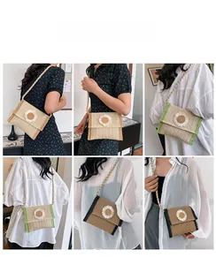 Detail view of woven straw crossbody bags featuring decorative white daisy floral accents