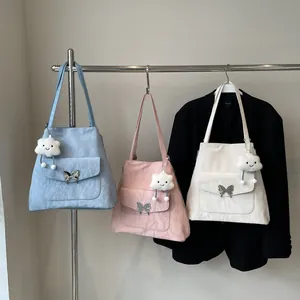 Detailed display of pastel tote bags with butterfly buckles and plush cloud charms