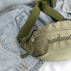 Olive green nylon crossbody bag with letter embroidery and adjustable shoulder strap