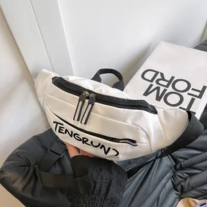 Detailed view of the white nylon chest bag featuring a black zipper and TENGRUN logo