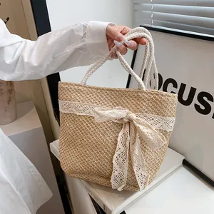Bolso tote de paja tejido a mano con lazo de encaje para vacaciones de verano y mar