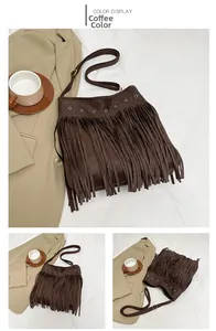 Detail view of a large brown tassel crossbody bag in faux suede with metal eyelets