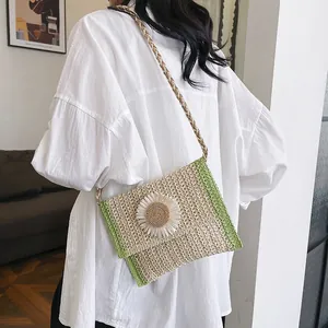 Handwoven straw crossbody bag with large 3D daisy flower and thin hemp rope strap