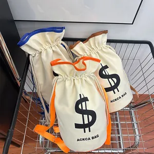 Close-up of three canvas bucket bags in orange blue and brown inside a metal cart