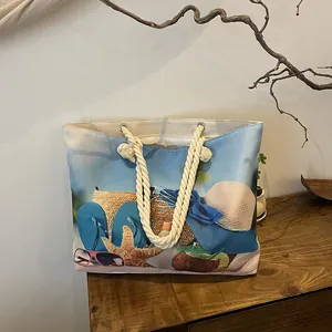 Detail of a beach canvas tote with rope handles and colorful summer holiday prints