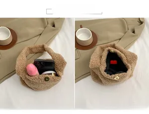 Detail of plush lamb-like fabric handbag featuring inner magnetic closure and pocket