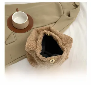 Close-up of the plush tote bag showing the magnetic closure and spacious black lining