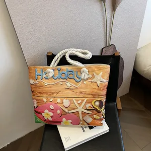 Detail of canvas tote bag with Holiday print, starfish motifs and thick cotton rope handles