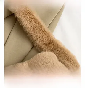 Close-up of premium khaki faux fur and diagonal twill fabric texture on handbag
