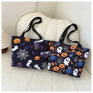 Detailed close-up of Halloween tote bags with ghost and pumpkin patterns on soft background