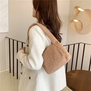 Detail of soft khaki faux fur tote bag showing the plush lamb wool texture on shoulder