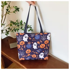 Detail of purple canvas tote bag featuring spooky Halloween ghosts and pumpkin prints