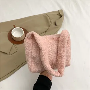 Detail of pink faux lamb wool texture on a stylish autumn-winter plush handbag