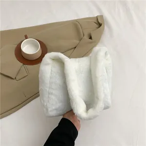 Detail showing the soft texture and thick white faux fur of this minimalist tote bag