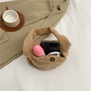 Brown fluffy teddy plush handbag showing daily storage capacity with magnetic closure