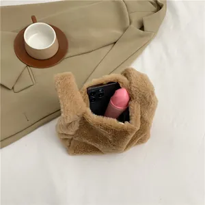 Chic brown plush underarm handbag with soft faux fur and elegant minimalist design