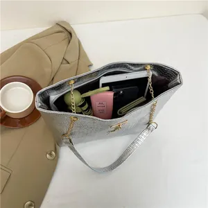 Silver crocodile texture tote bag with gold chain strap for stylish office commuting