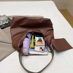 Brown vintage large capacity tote bag with inner pouch showing tablet and umbrella