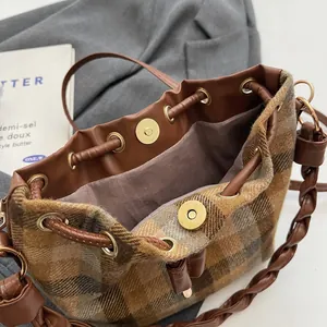 Retro plaid wool bucket bag with drawstring and woven strap for autumn fashion