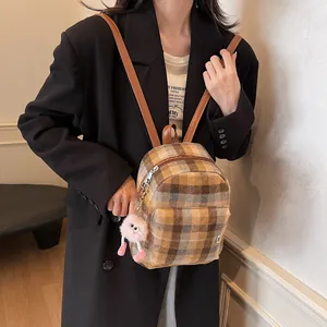 British style plaid wool backpack with brown leather straps and plush charm decor