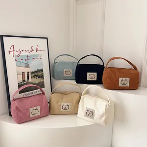 Chic corduroy cosmetic bag set in six colors featuring cute bear patch and handle