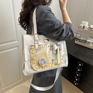 Detail of white Itabag with lace trim, clear PVC window and adjustable wide fabric strap
